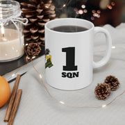 White mug with '1 Sqn' design on a table with decorative items